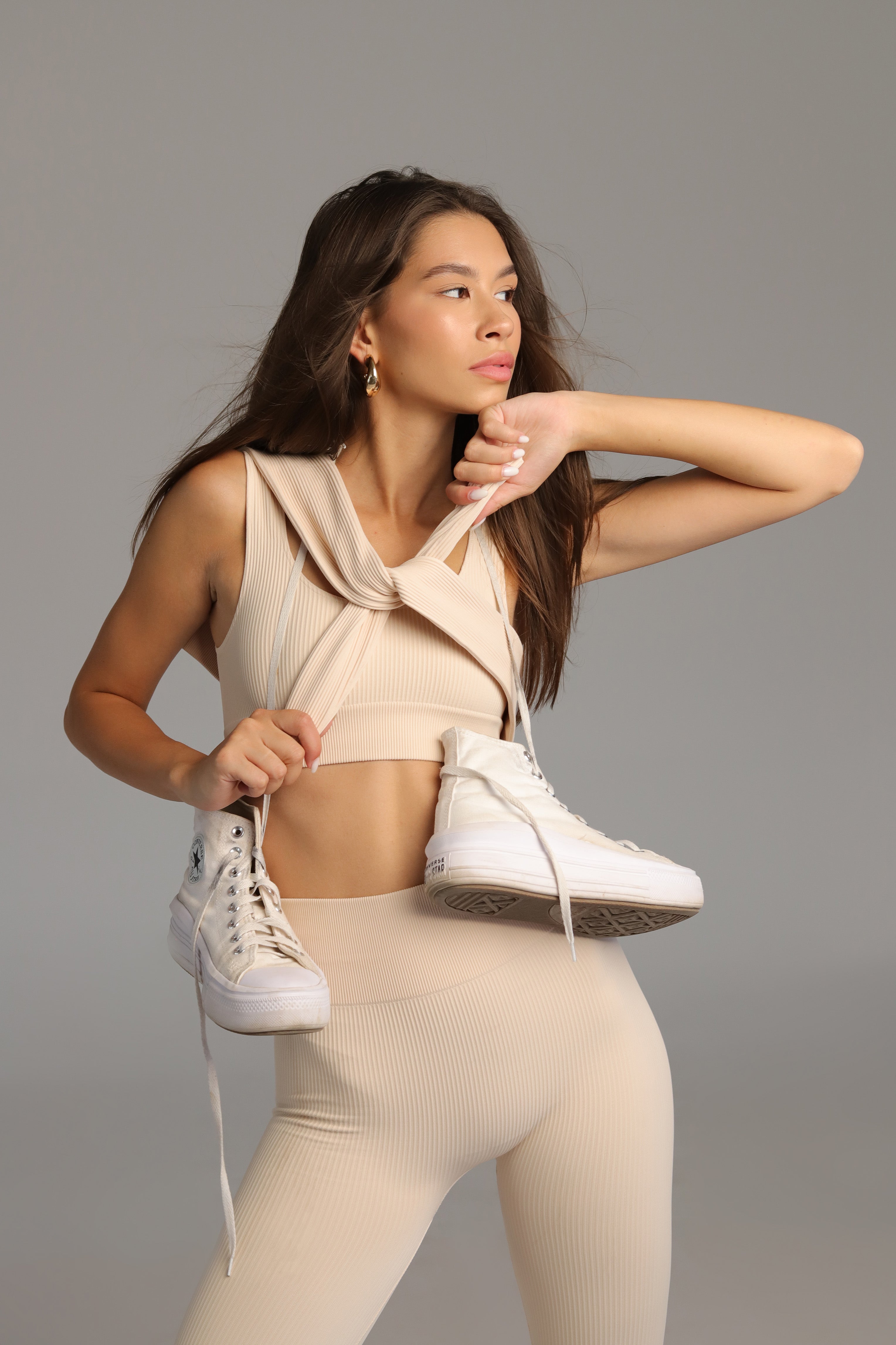 A seamless ribbed wide strap sport top in cream